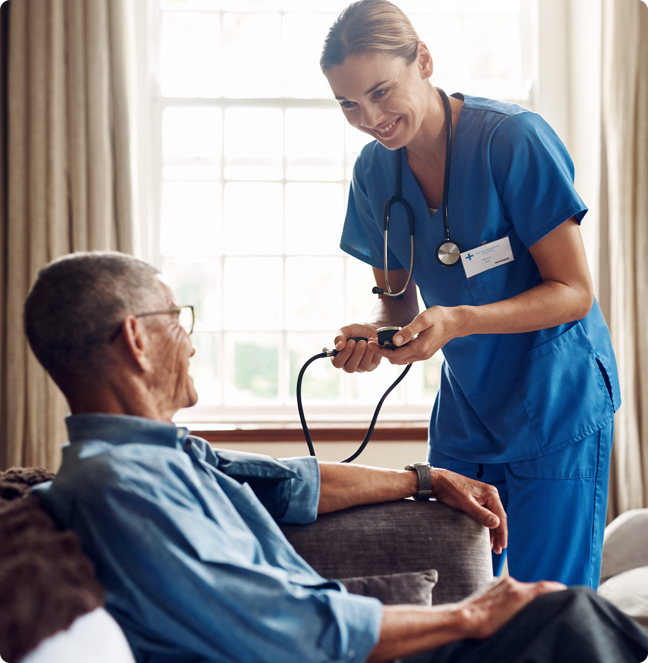 Healthcare worker assisting senior