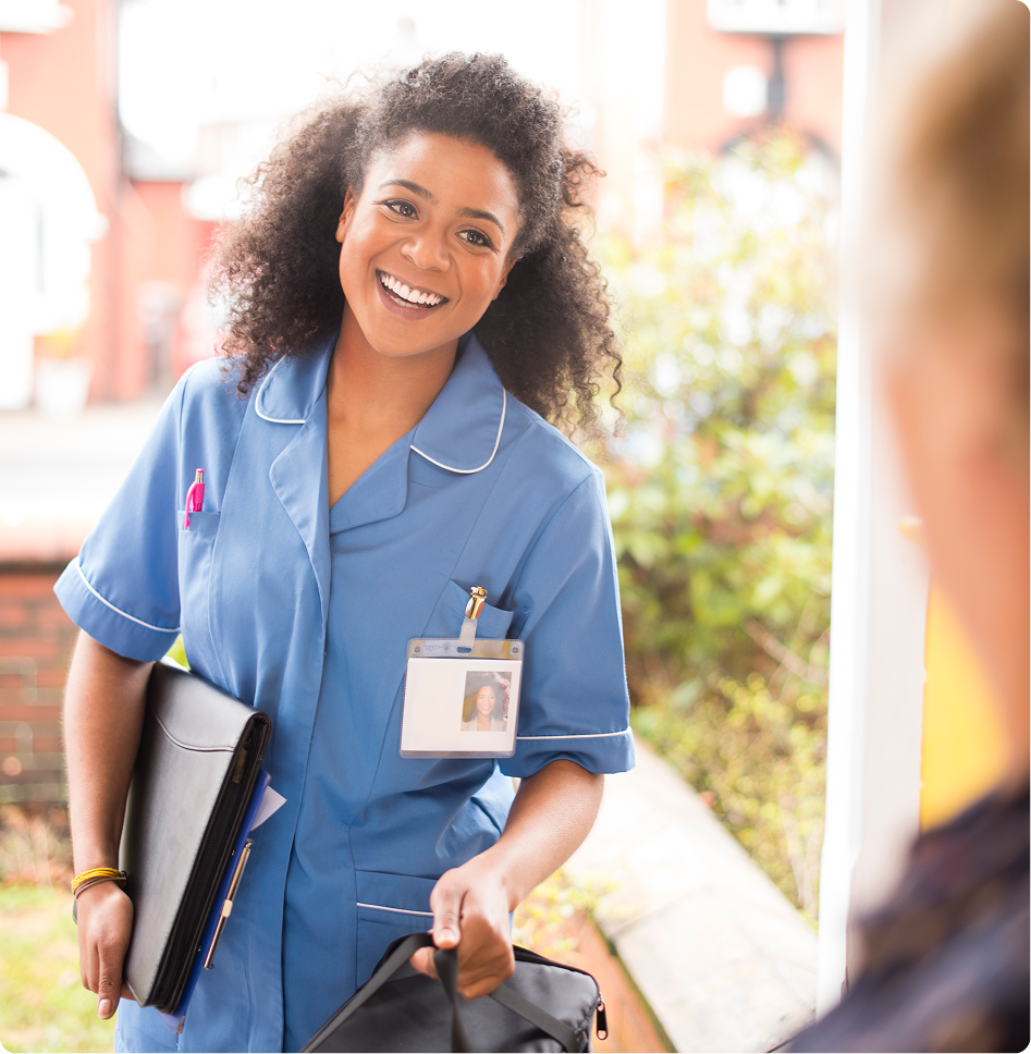 Smiling nurse visiting a patient