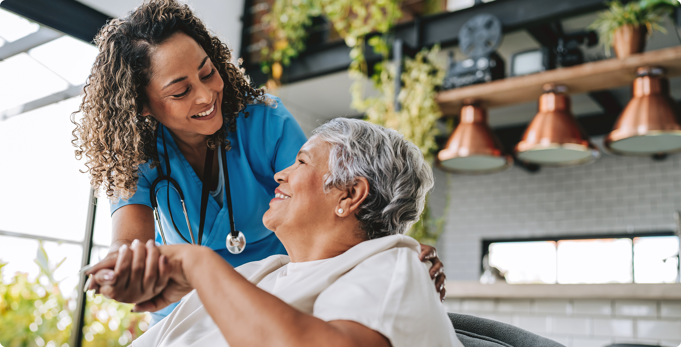 Healthcare worker assisting elderly person