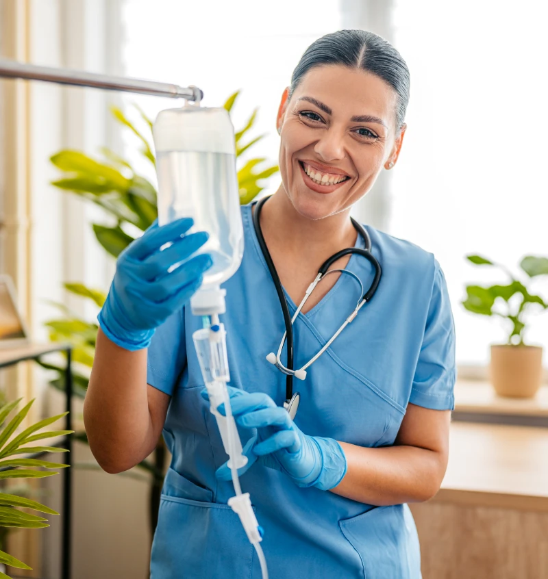 Medical professional holding IV drip