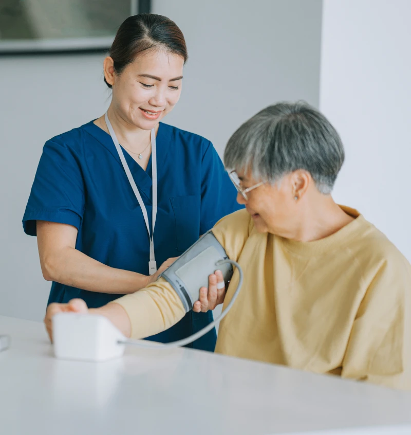 Elderly patient having blood pressure checked