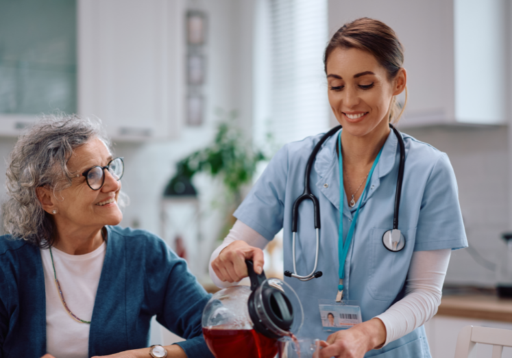 Healthcare worker assisting older adult at home